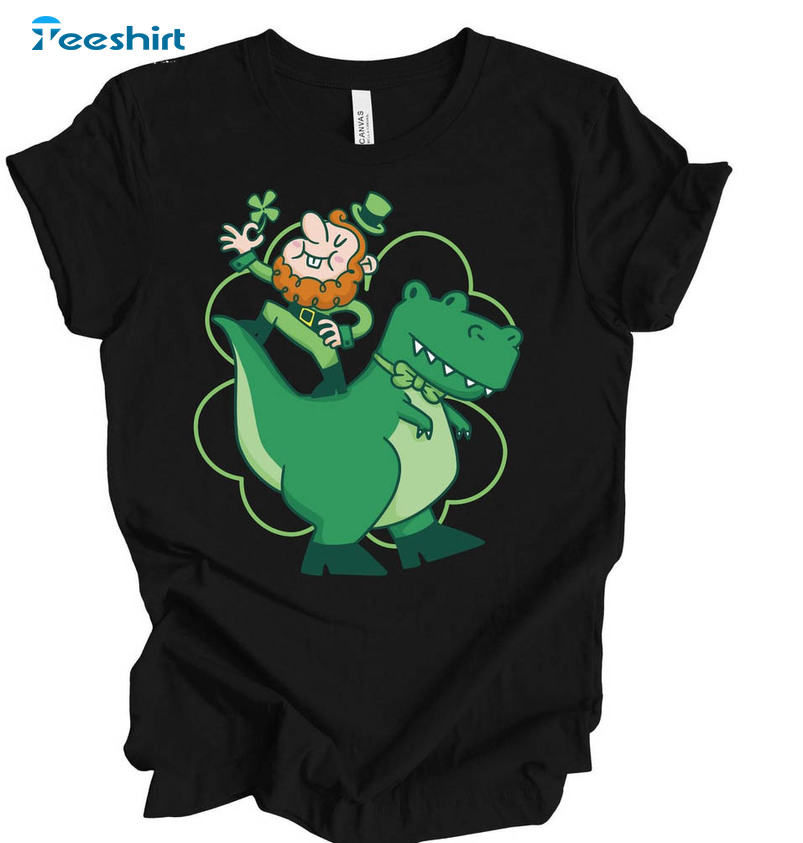 Funny St Patricks Day Shirt, Leprechaun On Dinosaur Short Sleeve Crewneck