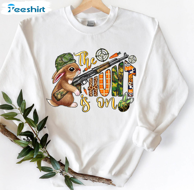 The Hunt Is On Funny Shirt, Easter Carrot And Camouflage Eggs Long Sleeve Tee Tops